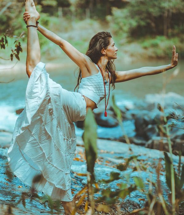 Woman in a graceful yoga pose, finding balance and harmony.